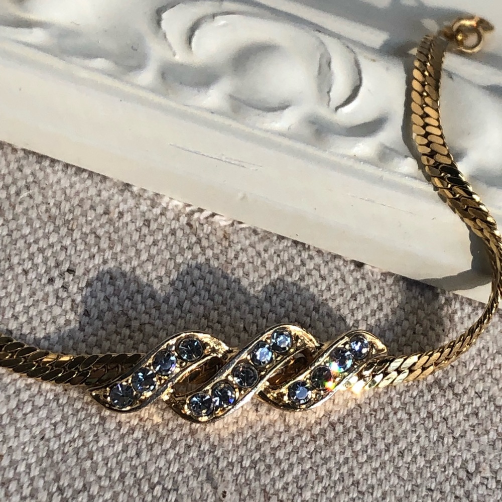 Delicate vintage rhinestone gold tone bracelet by Avon